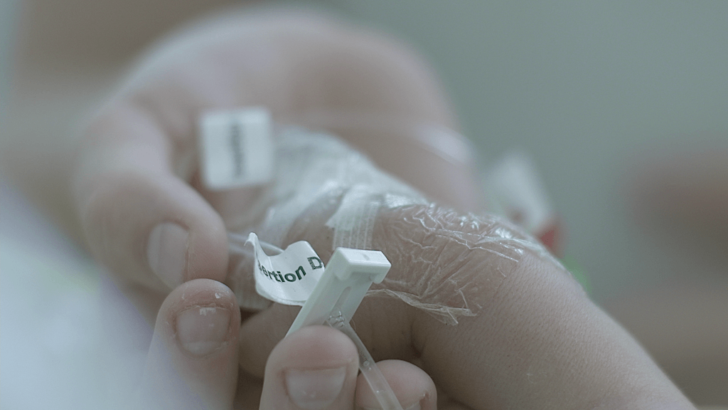 brother holding baby's hand 3